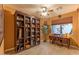 Home office with built-in shelves and a writing desk at 3604 N 162Nd Ave, Goodyear, AZ 85395