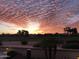 Dramatic sunset view over the golf course and community at 3604 N 162Nd Ave, Goodyear, AZ 85395