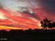 Vibrant sunset over the community and golf course at 3604 N 162Nd Ave, Goodyear, AZ 85395