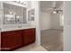 Bathroom with wood cabinets and view of bedroom at 4044 E Oakland St, Gilbert, AZ 85295