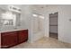 Bathroom with wood cabinets, bathtub, and walk-in closet at 4044 E Oakland St, Gilbert, AZ 85295