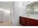 Bathroom features a cherry vanity cabinet, white countertop, and tiled floors at 4044 E Oakland St, Gilbert, AZ 85295