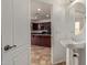 Small bathroom with pedestal sink and view of kitchen at 4044 E Oakland St, Gilbert, AZ 85295