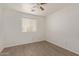 Bright bedroom with ceiling fan and window blinds at 4044 E Oakland St, Gilbert, AZ 85295