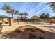 Relaxing community pool area with palm trees and seating at 4044 E Oakland St, Gilbert, AZ 85295