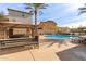 Refreshing community pool with picnic tables under a shaded pergola at 4044 E Oakland St, Gilbert, AZ 85295