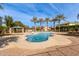 Relaxing community pool with palm trees and a shaded seating area at 4044 E Oakland St, Gilbert, AZ 85295