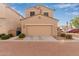 Two-story house with tan exterior and a two-car garage at 4044 E Oakland St, Gilbert, AZ 85295