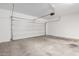 Spacious garage with a roll-up door and a smooth concrete floor at 4044 E Oakland St, Gilbert, AZ 85295