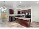 Kitchen features an island with stainless steel appliances, and dark wood cabinetry at 4044 E Oakland St, Gilbert, AZ 85295