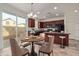 Modern kitchen with dark wood cabinets and breakfast bar at 4044 E Oakland St, Gilbert, AZ 85295