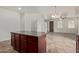 Kitchen island with dark wood cabinets and granite countertop at 4044 E Oakland St, Gilbert, AZ 85295