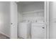 Neat laundry room features a side-by-side washer and dryer with overhead shelf at 4044 E Oakland St, Gilbert, AZ 85295