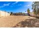 Spacious backyard featuring a dirt landscape with a block wall fence at 4124 N 105Th Ln, Phoenix, AZ 85037