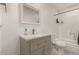 Bathroom featuring a vanity with mirror and combined shower and tub at 4124 N 105Th Ln, Phoenix, AZ 85037