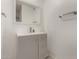 Bathroom featuring a gray vanity with quartz countertop and a white framed mirror at 4124 N 105Th Ln, Phoenix, AZ 85037