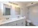 Updated bathroom with double vanity and tiled shower at 4202 W Wood Dr, Phoenix, AZ 85029