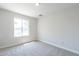 Bright bedroom with carpeted floor and a window offering natural light at 4202 W Wood Dr, Phoenix, AZ 85029