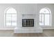 White brick fireplace with arched windows at 4202 W Wood Dr, Phoenix, AZ 85029