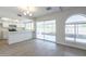 Eat-in kitchen with white cabinets and sliding door to patio at 4202 W Wood Dr, Phoenix, AZ 85029