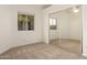 Bright bedroom featuring mirrored closet doors and carpet flooring at 4322 E South Fork Dr, Phoenix, AZ 85044