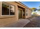 Back exterior of house with door and landscaping at 4322 E South Fork Dr, Phoenix, AZ 85044