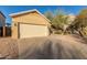 Tan house with two-car garage and desert landscaping at 4322 E South Fork Dr, Phoenix, AZ 85044