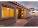 Back exterior of house with door and landscaping at 4322 E South Fork Dr, Phoenix, AZ 85044