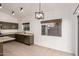 Kitchen features olive green cabinets and stainless steel appliances at 4322 E South Fork Dr, Phoenix, AZ 85044