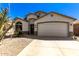 Single-story home with desert landscaping and two-car garage at 45579 W Rainbow Dr, Maricopa, AZ 85139