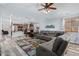 Relaxing living room with sectional sofa and view into kitchen at 45579 W Rainbow Dr, Maricopa, AZ 85139