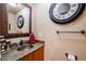 Bathroom with granite countertop and decorative mirror at 5432 W Fallen Leaf Ln, Glendale, AZ 85310