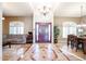 Elegant entryway with high ceilings, a hardwood door, and tile flooring at 5432 W Fallen Leaf Ln, Glendale, AZ 85310