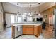 Large kitchen island with sink, dishwasher, and ample counter space at 5432 W Fallen Leaf Ln, Glendale, AZ 85310