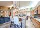 Spacious kitchen featuring an island, stainless steel appliances, and wood cabinets at 5432 W Fallen Leaf Ln, Glendale, AZ 85310