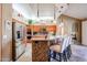 Kitchen with island, stainless steel appliances, and light wood cabinets at 5432 W Fallen Leaf Ln, Glendale, AZ 85310