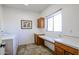 Laundry room with washer, dryer, and built-in cabinets at 5432 W Fallen Leaf Ln, Glendale, AZ 85310