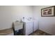 Laundry room with washer, dryer, utility sink, and cabinets at 5432 W Fallen Leaf Ln, Glendale, AZ 85310