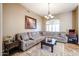 Comfortable living room featuring sectional sofa and coffee table at 5432 W Fallen Leaf Ln, Glendale, AZ 85310