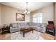 Spacious living room with a large sectional sofa and a cozy atmosphere at 5432 W Fallen Leaf Ln, Glendale, AZ 85310