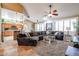 Open living room showcasing a comfortable sectional sofa and kitchen views at 5432 W Fallen Leaf Ln, Glendale, AZ 85310