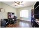 Home office with hardwood floors and large window at 5432 W Fallen Leaf Ln, Glendale, AZ 85310