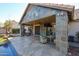 Expansive covered patio with built-in grill and outdoor seating at 5432 W Fallen Leaf Ln, Glendale, AZ 85310