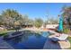 Inviting swimming pool surrounded by a spacious patio and comfortable lounge chairs at 5432 W Fallen Leaf Ln, Glendale, AZ 85310