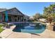 Inviting kidney shaped pool with flagstone decking, perfect for relaxation at 5432 W Fallen Leaf Ln, Glendale, AZ 85310