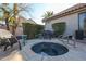 Relaxing spa with flagstone decking and comfortable seating area at 5432 W Fallen Leaf Ln, Glendale, AZ 85310