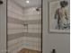 Spa-like shower with textured tile and a frameless glass enclosure at 6525 E Cave Creek Rd # 14, Cave Creek, AZ 85331