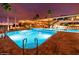 Evening view of resort-style pool and clubhouse at 6562 S Sawgrass Dr, Chandler, AZ 85249