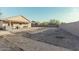 Spacious backyard with covered patio, firepit, and gravel landscaping at 6910 S 26Th Ln, Phoenix, AZ 85041