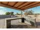 Outdoor kitchen and patio area with built-in grill at 6910 S 26Th Ln, Phoenix, AZ 85041